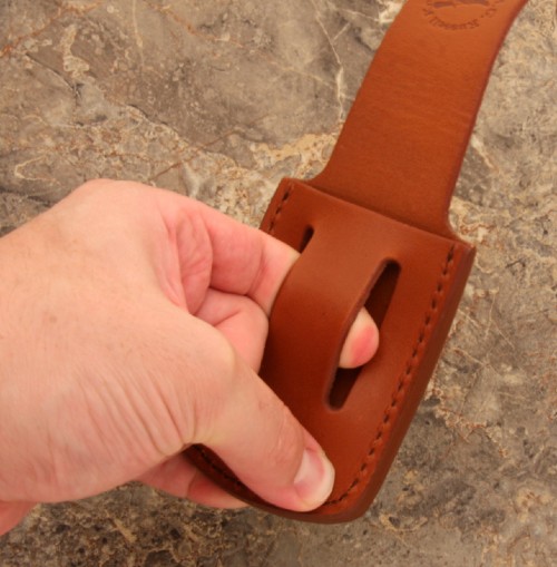 Stretching belt loop in leather knife pouch